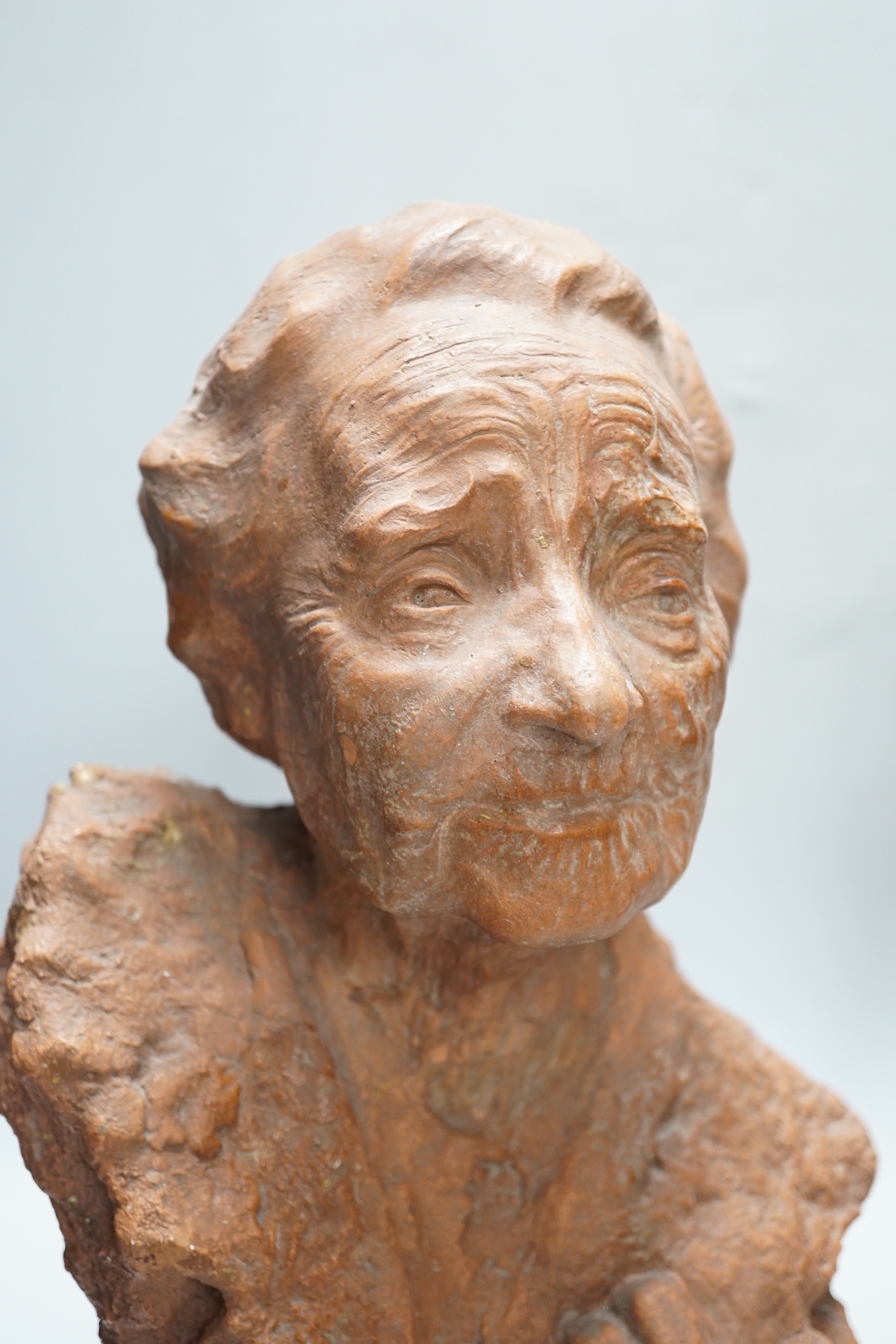 Marcus Cornish (1964-) - ‘’Refugee’’, a terracotta sculpture and one other terracotta sculpture of a mother and child, indistinctly signed, the largest 46cm high (2)